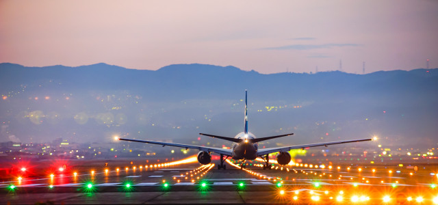 Night view of an airport and aircraft